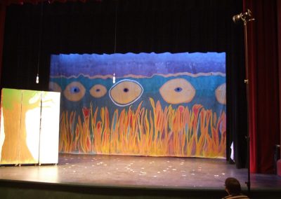 set of a play using mendoza's artwork