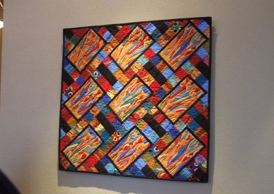 picture of mendoza's abstract painting with rectangles and square shapes