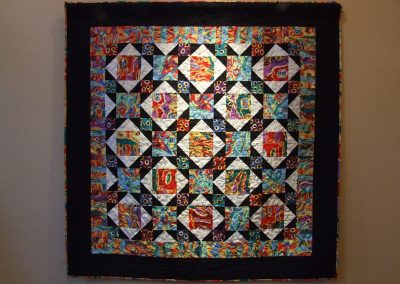 picture of mendoza's work with black border and colorful abstract squares