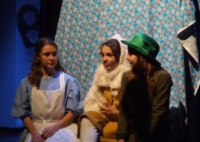 alice talking with the mad hatter and white rabbit