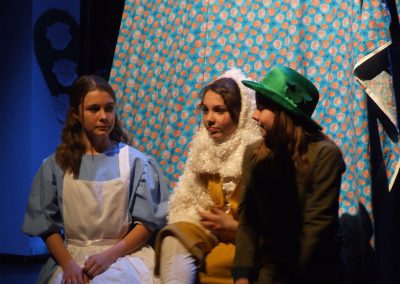 alice talking with the mad hatter and white rabbit