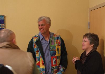 photo of mendoza smiling at his art show