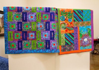 photo of two of mendoza's quilt artworks