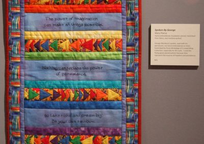 photo of one of mendoza's work with a red border and multicolored shapes and lines