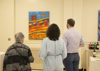 people viewing george mendoza's painting