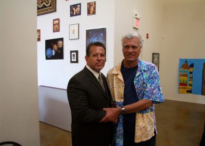 mendoza posed with a man at the art gallery