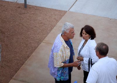 mendoza talking with two people