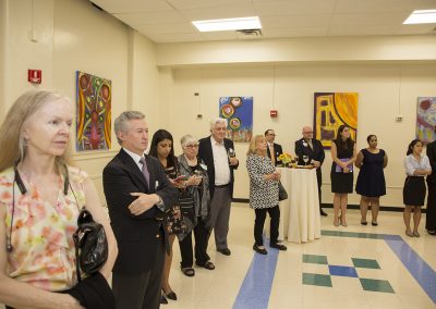 people observing mendoza's artwork