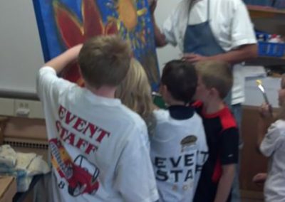 mendoza painting while children help