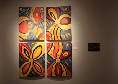 photo of mendoza's artwork of four flower paintings